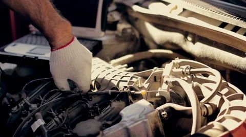 Car  service, computer diagnostics: mechanic looks for errors in the car Vídeos de archivo 55552979