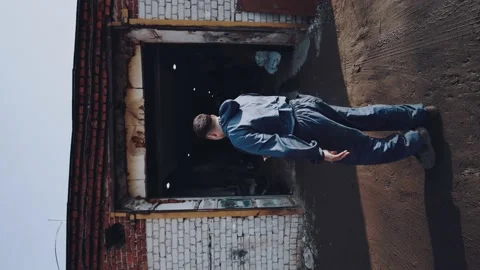 The car service master dusts off his hands and closes the gate Stock Footage 187561553