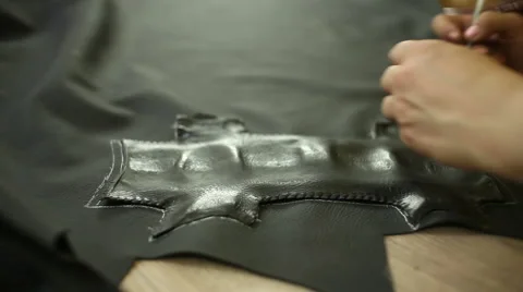 Car service station: creating patterns of leather for the car steering wheel Video stock 52615538