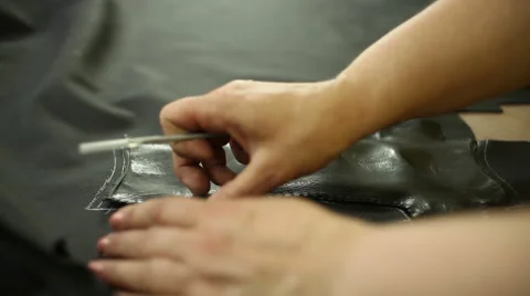 Car service station: creating patterns of leather for the car steering wheel Video stock 52615633