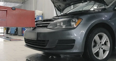 Car Service. Testing Headlights Adjust Low Beam. Turning On A Headlight Stock-Footage 125009300