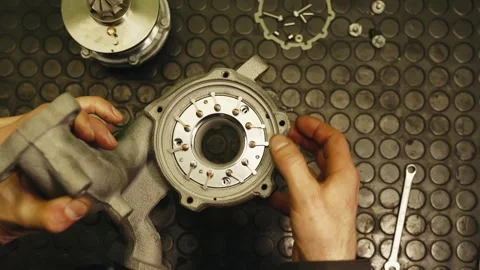 Car serviceman show on camera inside an automobile turbine turbocharger Stock Footage 285642531