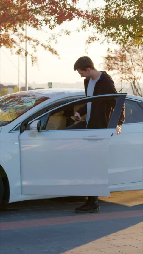Car sharing client gets into rented vehicle to start ride Stock Footage 300549384