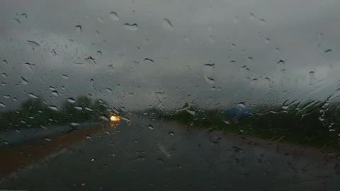 Car side mirror and drivers window with drops of rain Stock Footage 120778343