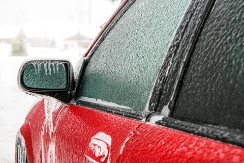 Car side mirror and window frozen after freezing rain Stock Photos