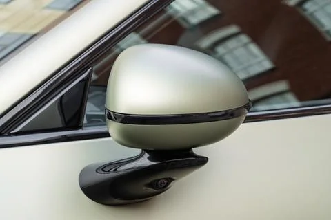 Car side mirror with integrated camera for driver safety, visibility. Stock Photos
