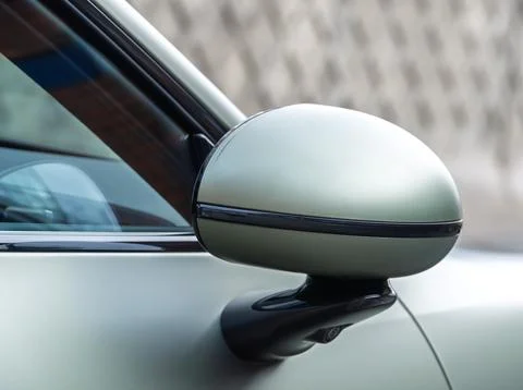 Car side mirror with integrated camera for driver safety, visibility. Stock Photos