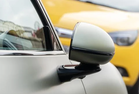 Car side mirror with integrated camera for driver safety, visibility. Stock Photos