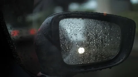 Car side mirror in rain while traffic jam Stock Footage 78998346