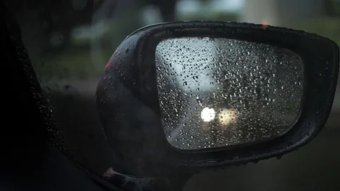 Car side mirror with raining while traffic jam Stock Footage 79760630