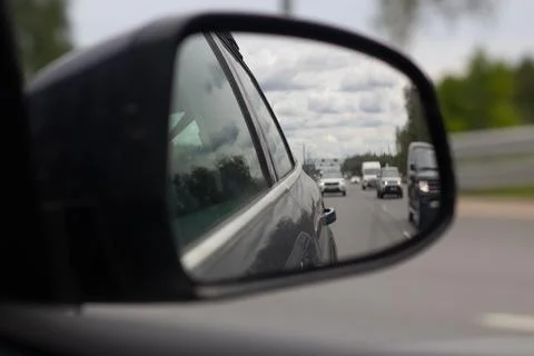 Car Side Mirror Reflection On A Highway Stock Photos