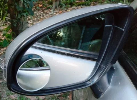 Car side mirror with reflection Stock Photos