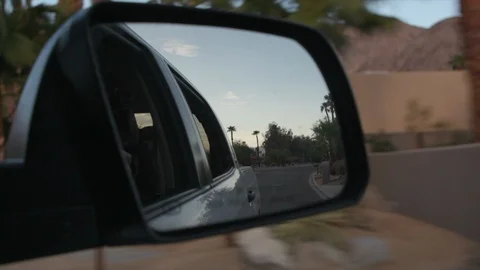 Car Side Mirror View of Happy Dog with Head Out the Window Stock Footage 96228751