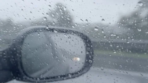 Car Side Mirror View Through Wet Passenger Window in Rain Video stock 327588966