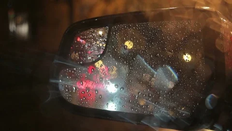 Car side view mirror on rainy night Video stock 81221823