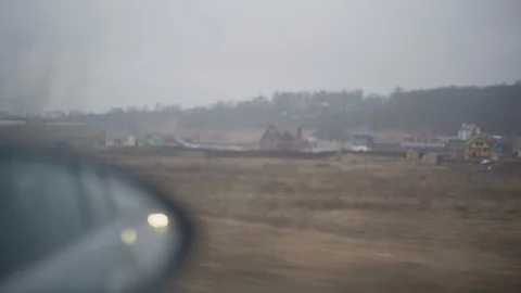 Car side window view driving around flat landscape Video stock 127977774