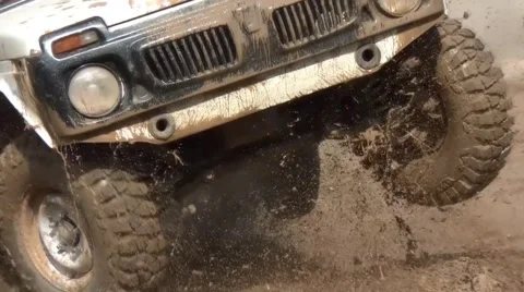 Car slowly passes a puddle Stock Footage 48985864