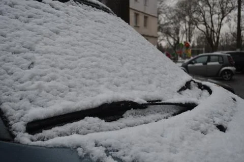 A car with a snow covered windshield. Stock Photos