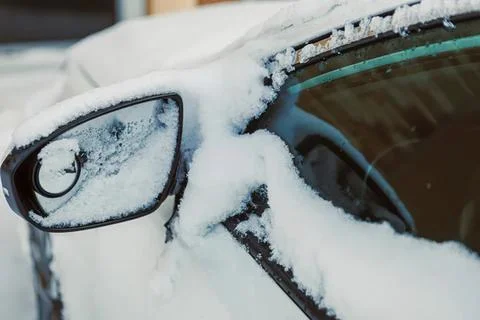 Car with snow on windows in winter cold weather Stock Photos