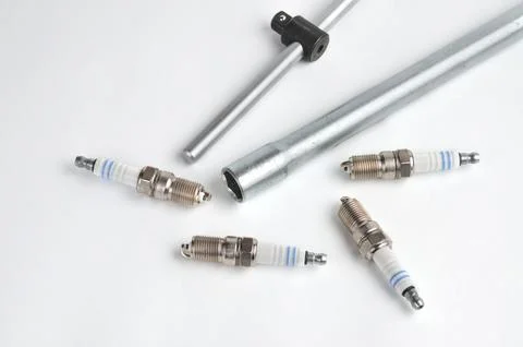Car spark plug on isolated white background Stock Photos