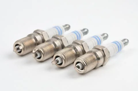 Car spark plug on isolated white background Stock Photos