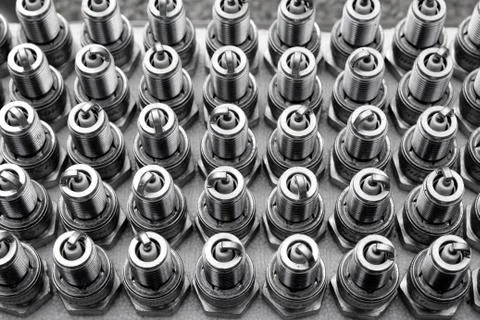 Car spark plugs rows pattern mechanical engine pieces Stock Photos