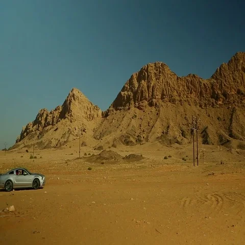 Car speeding on desert. Stock Footage 69495614