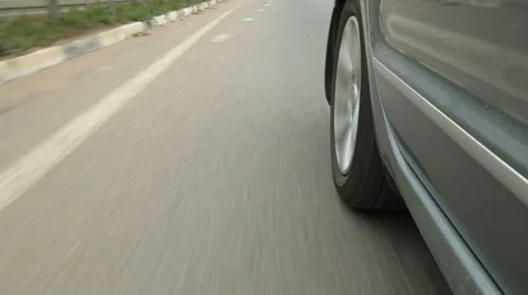 Car speeding down the highway along dividing line Stock Footage 39508402