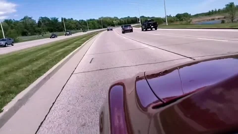 Car speeding down highway Stock Footage 311319541