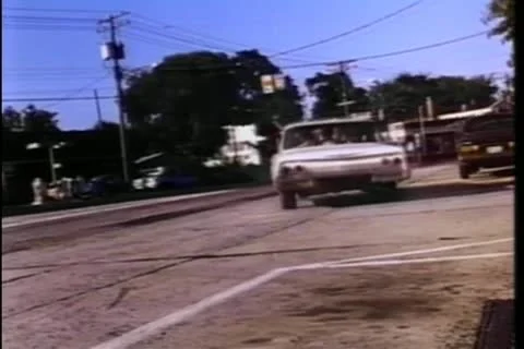 Car speeding down road Stock Footage 11352816