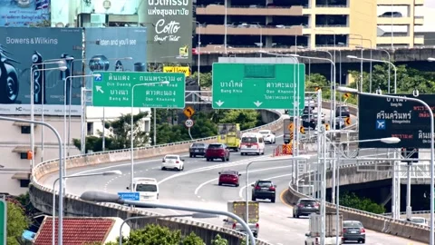 Car speeding through highway with traffic sign showing direction and warning Stock-Footage 158918676