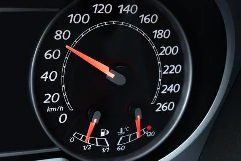 Car speedometer dial with red backlit close-up Stock Photos