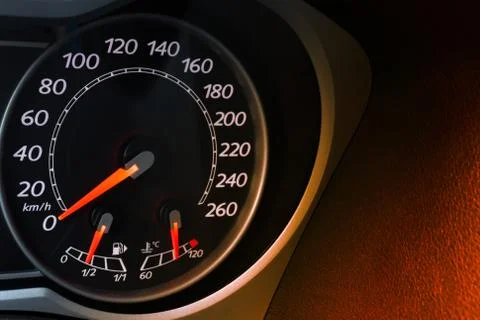Car speedometer dial with red backlit close-up Stock Photos