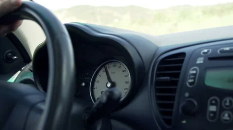 Car speedometer, driver behind the wheel Stock Footage 54679914