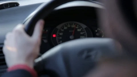 Car speedometer, driver behind the wheel Stock Footage 88154798