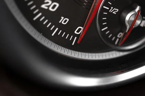 Car speedometer with red indicator close-up view, luxury car interior backgro Stock Photos