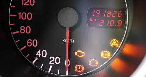 Car speedometer turning on with check engine and warning lights 스톡 동영상 338339131