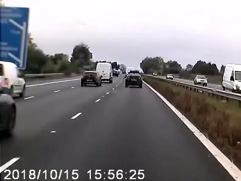 Car Speeds Down Wrong Side Of Highway, Oxfordshire, UK - 15 Oct 2018 Stock Footage 205239266