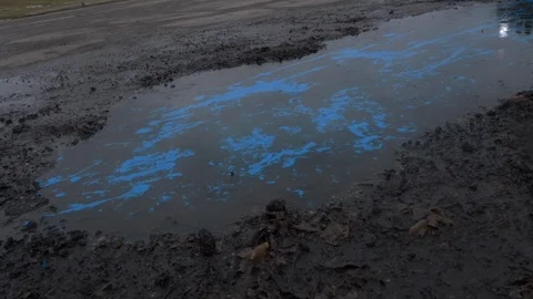 Car splashing pothole Stock Footage 124868576