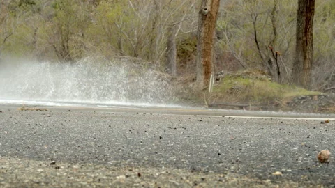 Car splashing water Stock Footage 235384949