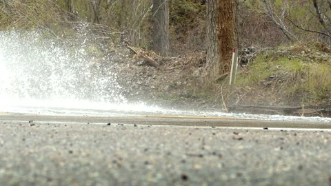 Car splashing water Stock Footage 235385250