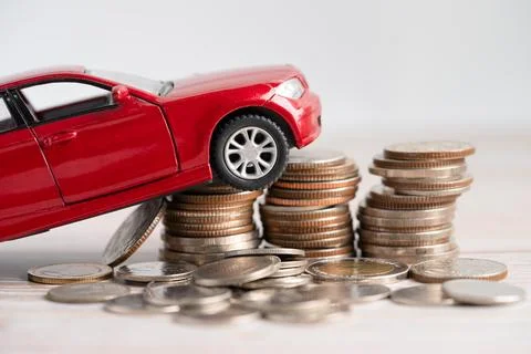 Car on stack of coins. Car loan, Finance, saving money, insurance and leasi.. Stock Photos