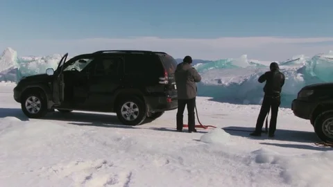 Car stalled on snowy road Stock Footage