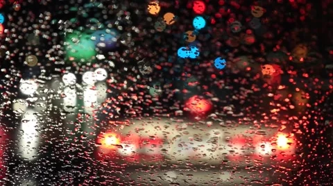 Car standing at red light, shot from interior, rainy night Stock Footage 56733285