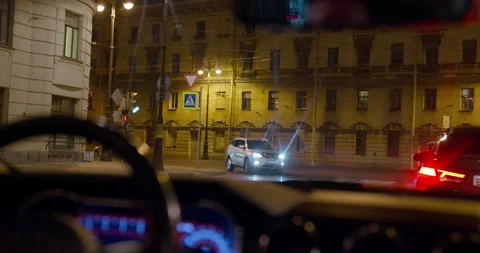 Car is standing on the road at intersection during a red traffic light, shooting Stock Footage 168718287