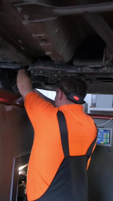 The car is standing on a stand for adjusting car wheels in a car workshop Stock Footage 250342907