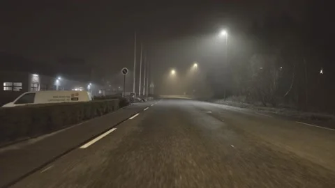 Car starts chasing camera car on a foggy night in 4K Video stock 139489095