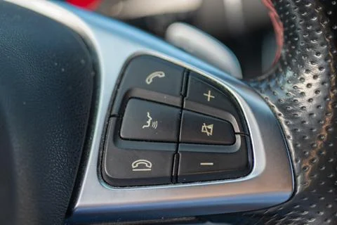 Car steering wheel multimedia controls and telephone buttons Stock Photos