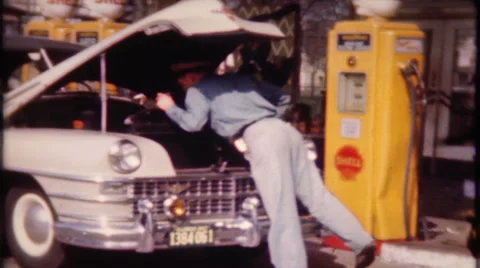 Car stops for gas at service station 1950s vintage film home movie 1834 Stock Footage 47792374