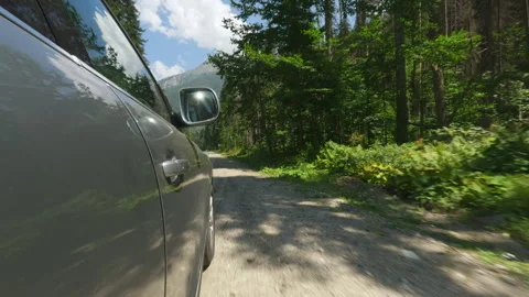 Car stops on the side of the road. Road overlooks the mountains and the forest. Stock Footage 249378096